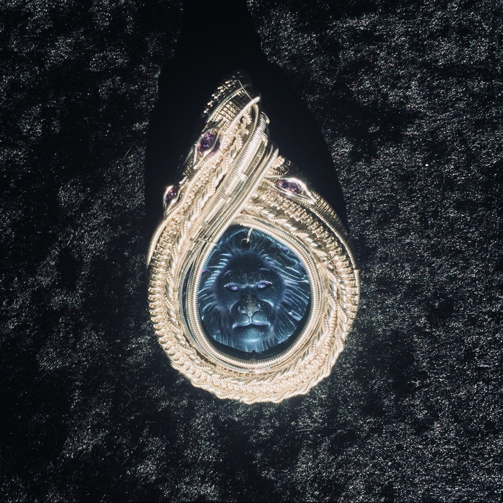 Titanium lion pendant